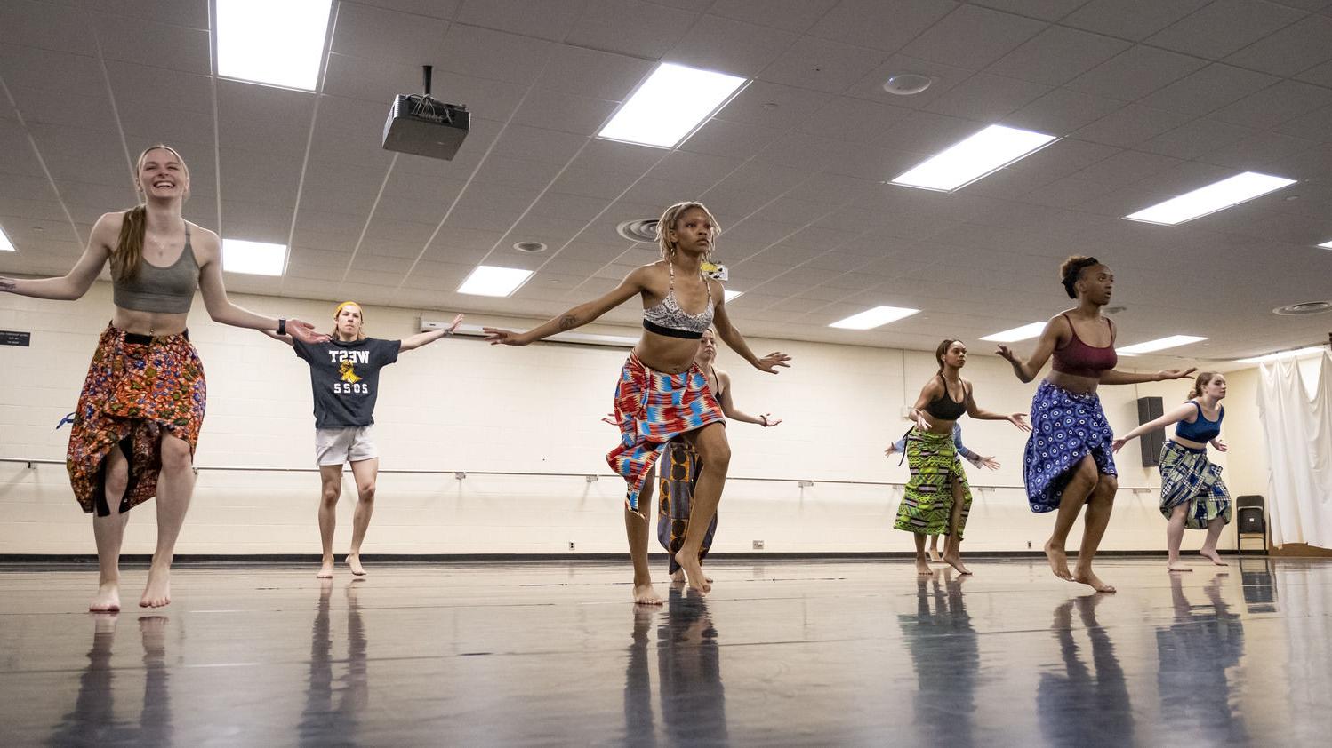 An image of students participating in a dance class.