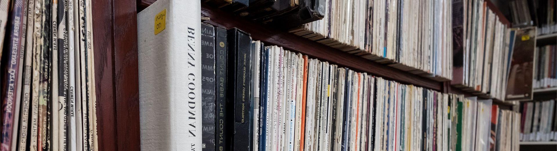 Bookshelf with multiple rows of music records